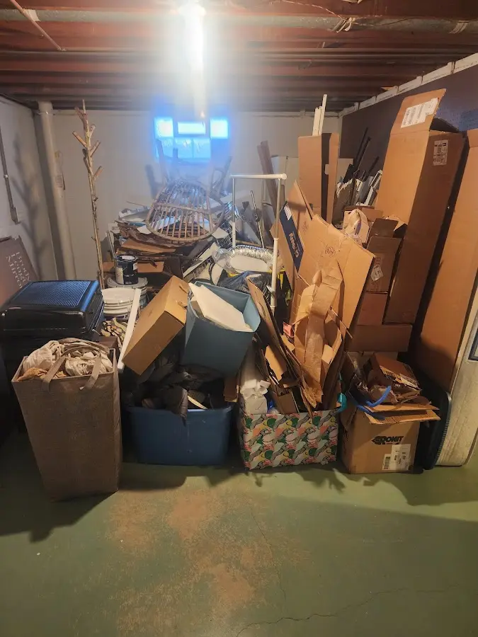 Roll-off dumpster container at job site for 2 Yard Dumpster Rental in Rockcreek